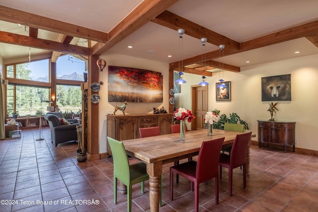 tiled dining room with beamed ceiling