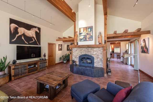 155 E Buck Mountain Rd, Jackson, WY 83001 - living room with baseboards, high vaulted ceiling, beam ceiling, and tile patterned flooring