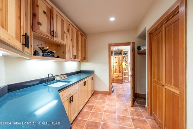 155 E Buck Mountain Rd, Jackson, WY 83001 - kitchen with light tile patterned floors, baseboards, recessed lighting, a sink, and light brown cabinetry