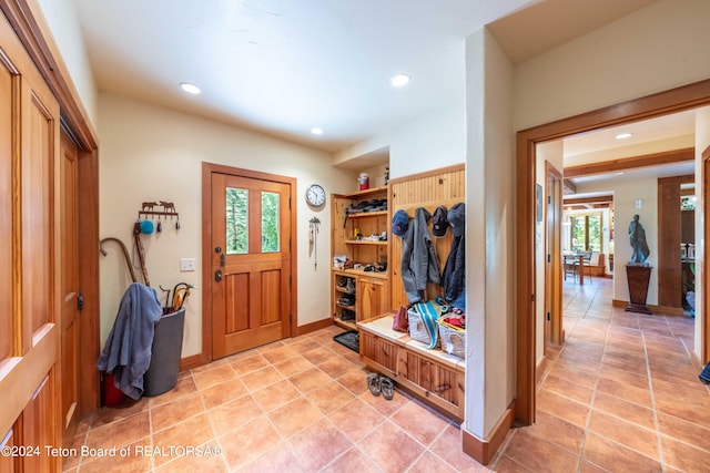 mudroom with light tile patterned floors