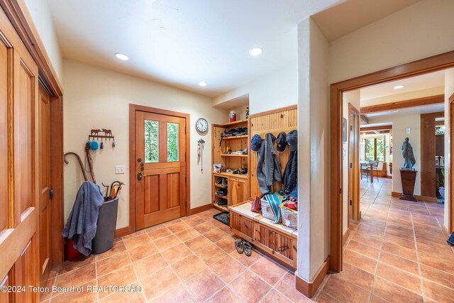 155 E Buck Mountain Rd, Jackson, WY 83001 - foyer entrance with light tile patterned flooring, baseboards, and recessed lighting