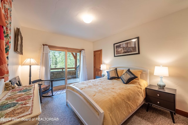 carpeted bedroom featuring access to outside