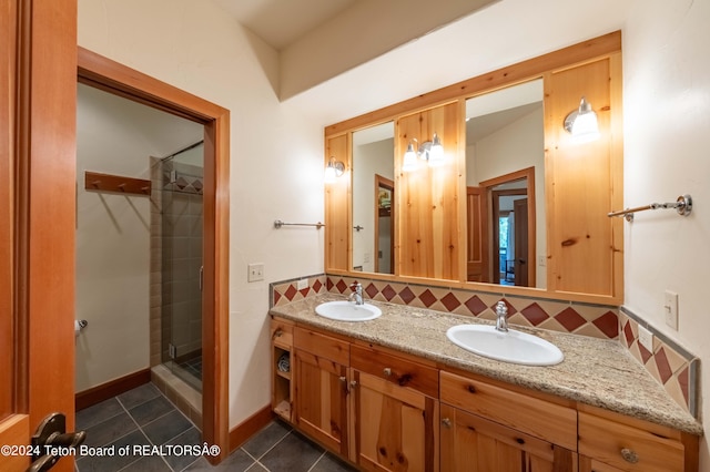 bathroom with backsplash, walk in shower, dual bowl vanity, and tile patterned flooring