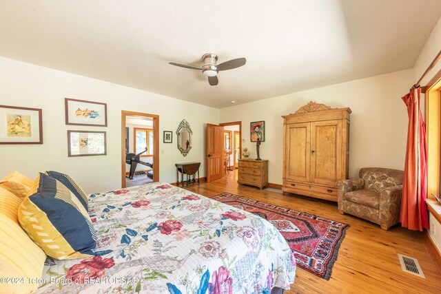 155 E Buck Mountain Rd, Jackson, WY 83001 - bedroom with baseboards, visible vents, a ceiling fan, and light wood finished floors
