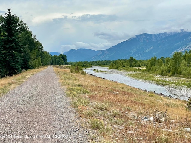 view of road featuring a water and mountain view