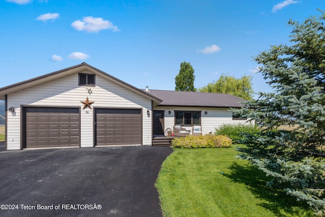 ranch-style home with a garage and a front yard