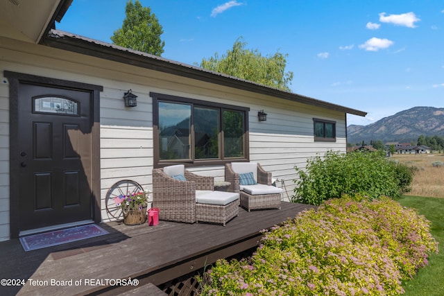 exterior space with a deck with mountain view