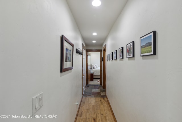 corridor with wood-type flooring