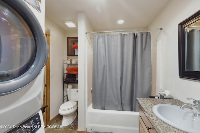 full bathroom featuring shower / bath combination with curtain, washer / dryer, tile patterned floors, toilet, and vanity