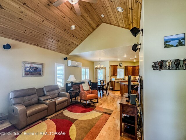 living room featuring a wall mounted air conditioner, light hardwood / wood-style flooring, ceiling fan with notable chandelier, and wood ceiling