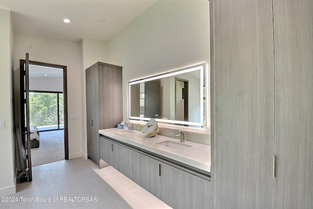 bathroom featuring tile patterned flooring and vanity