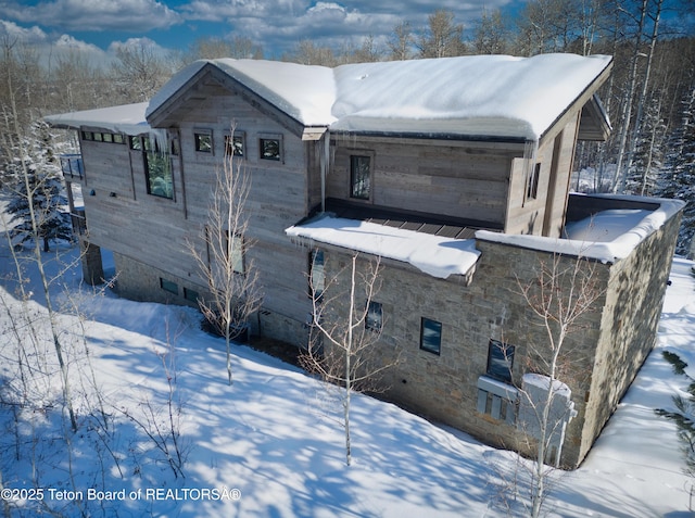 view of snow covered property