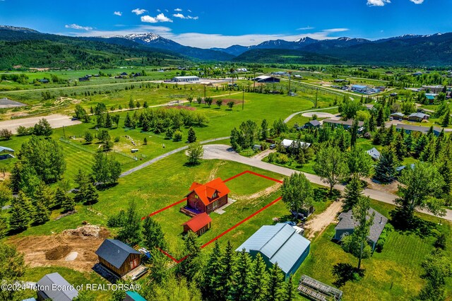 drone / aerial view featuring a mountain view