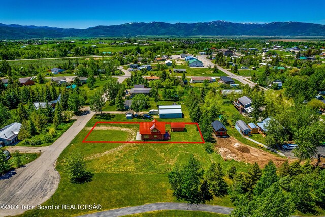 bird's eye view with a mountain view