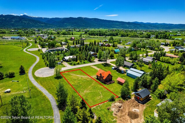 drone / aerial view featuring a mountain view