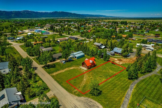 birds eye view of property featuring a mountain view