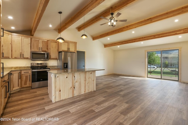 1424 Fairview Dr, Dubois, WY 82513 - kitchen featuring stainless steel appliances, light brown cabinets, a center island, light stone countertops, and wood finished floors