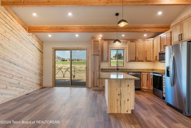 kitchen featuring dark hardwood / wood-style floors, stainless steel appliances, beamed ceiling, and wood walls