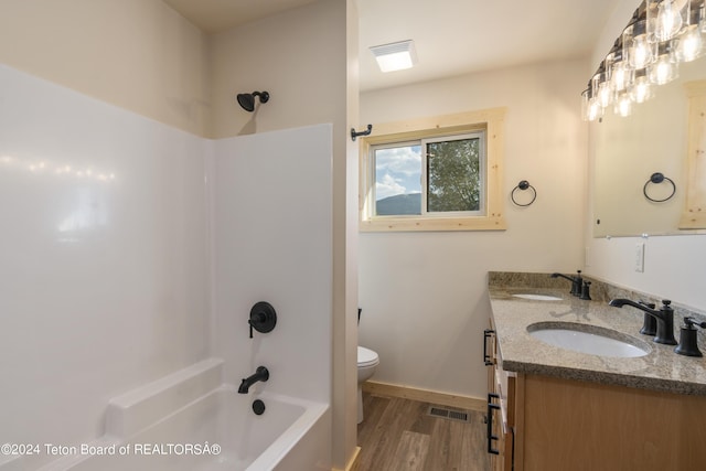 1424 Fairview Dr, Dubois, WY 82513 - bathroom with tub / shower combination, double vanity, and wood finished floors