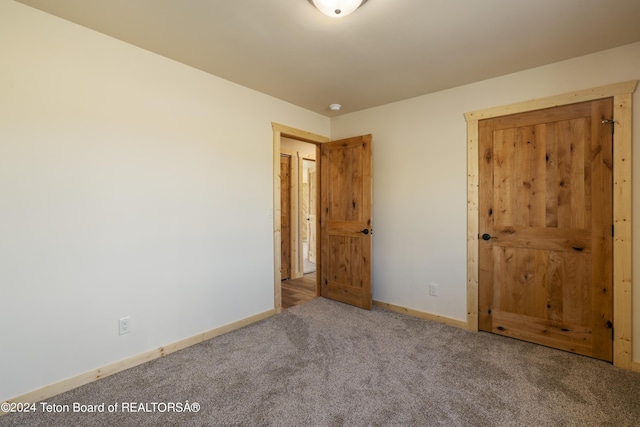 1424 Fairview Dr, Dubois, WY 82513 - unfurnished bedroom featuring carpet and baseboards