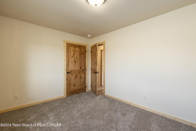1424 Fairview Dr, Dubois, WY 82513 - carpeted empty room with baseboards