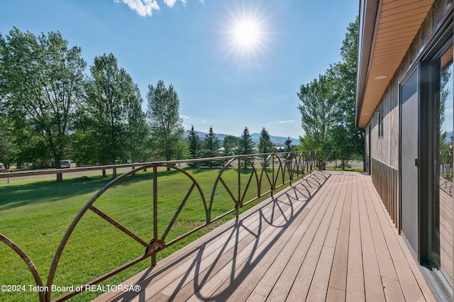 deck featuring a lawn