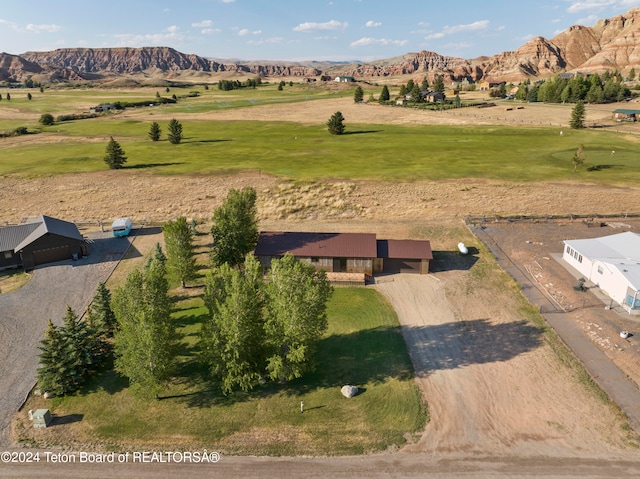 drone / aerial view featuring a mountain view and a rural view