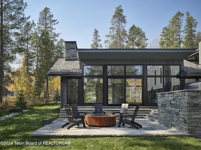 7750 N Lower Granite Ridge Rd, Teton Village, WY 83025 - view of patio / terrace with an outdoor fire pit