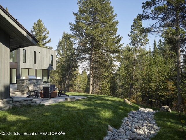 7750 N Lower Granite Ridge Rd, Teton Village, WY 83025 - view of grassy yard featuring a patio