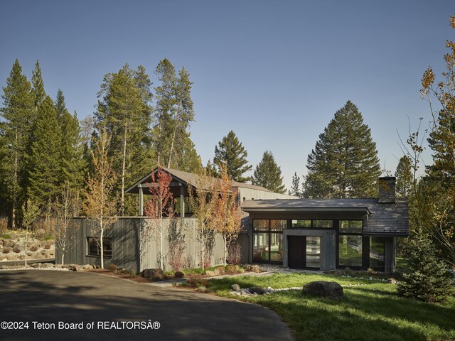 7750 N Lower Granite Ridge Rd, Teton Village, WY 83025 - view of front facade featuring a chimney