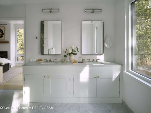 7750 N Lower Granite Ridge Rd, Teton Village, WY 83025 - bathroom with double vanity, plenty of natural light, and connected bathroom