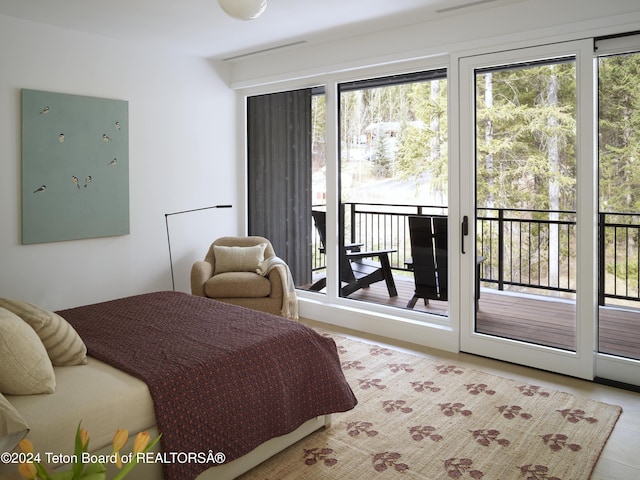 7750 N Lower Granite Ridge Rd, Teton Village, WY 83025 - bedroom with access to exterior and multiple windows