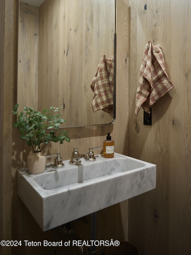 7750 N Lower Granite Ridge Rd, Teton Village, WY 83025 - bathroom featuring wooden walls and a sink