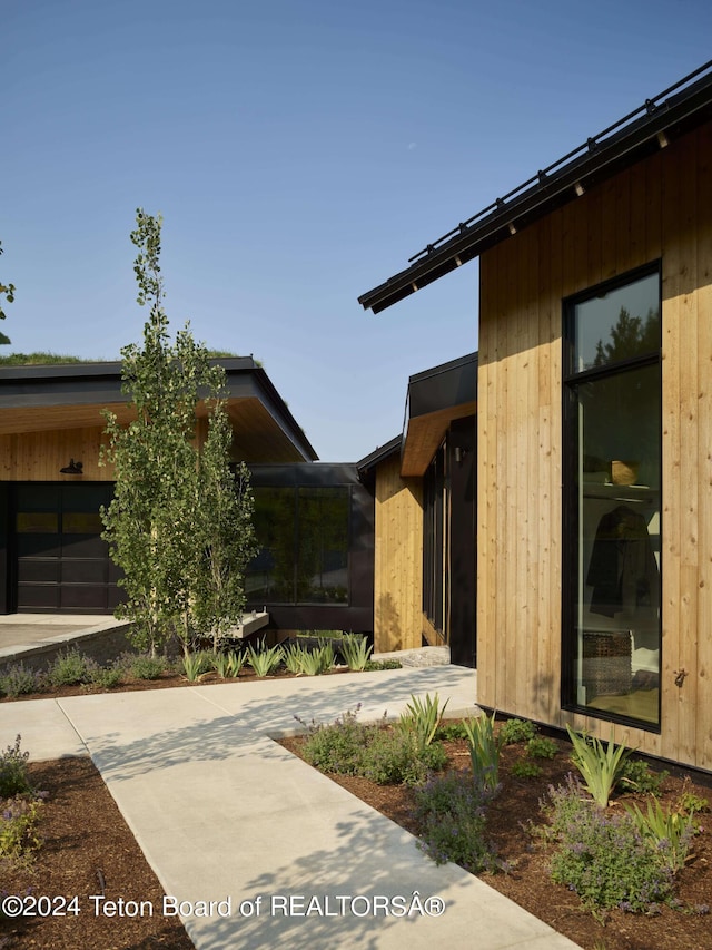 view of property exterior with a patio