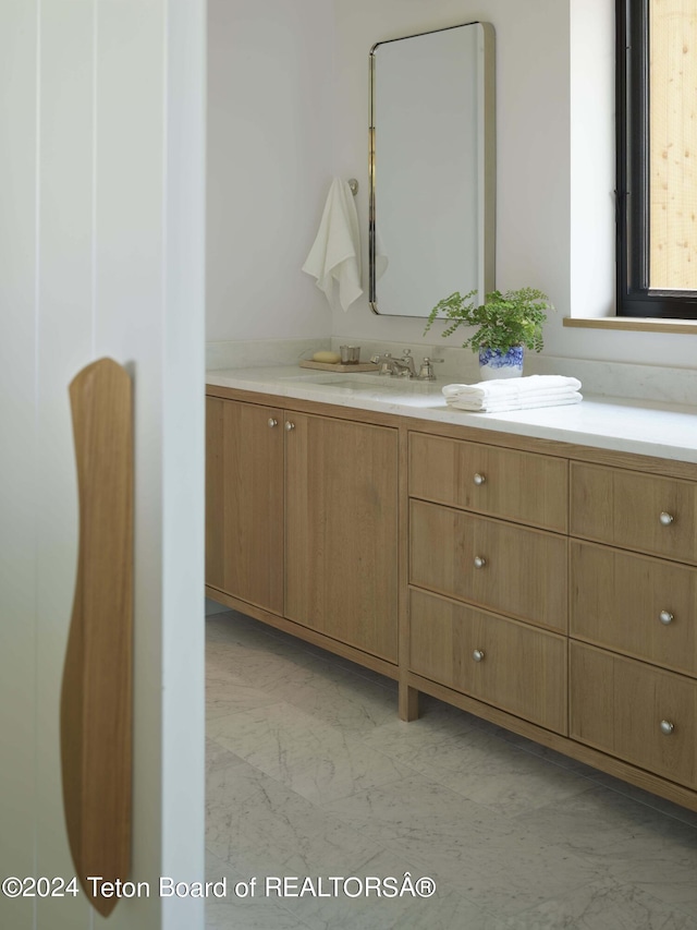 2680 Trader Rd, Jackson, WY 83001 - bathroom featuring marble finish floor and vanity