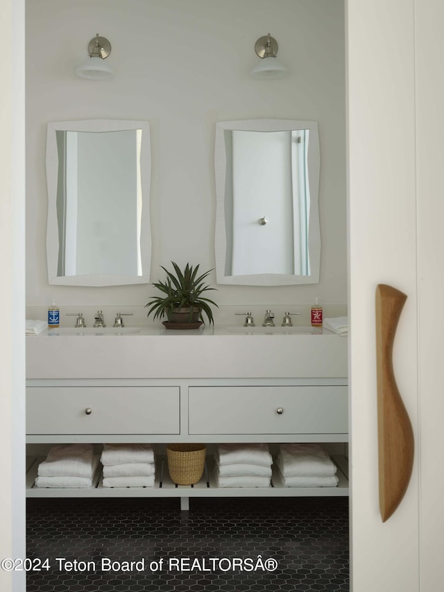 2680 Trader Rd, Jackson, WY 83001 - bathroom featuring a sink and double vanity