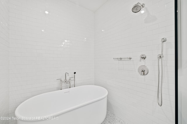 bathroom with tile walls