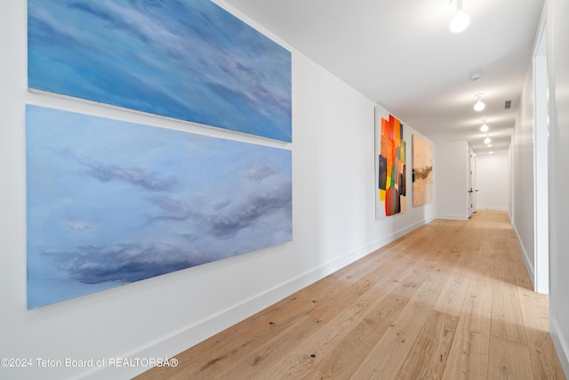 2680 Trader Rd, Jackson, WY 83001 - hallway with baseboards and hardwood / wood-style floors