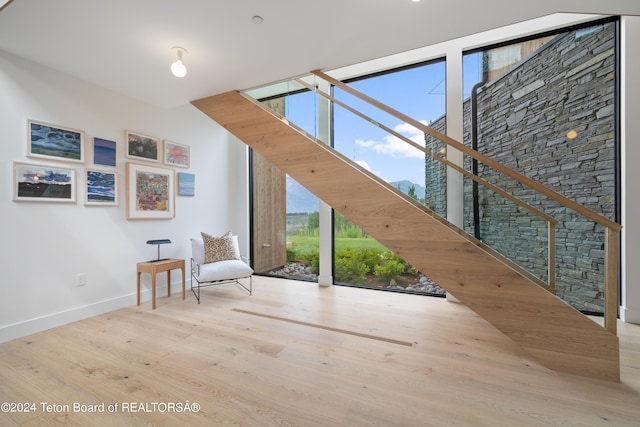 unfurnished room with light wood-type flooring