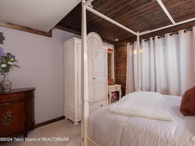 bedroom with carpet floors and wooden ceiling