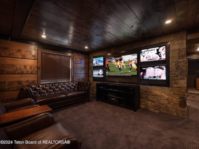 home theater featuring wood ceiling, wood walls, and carpet flooring