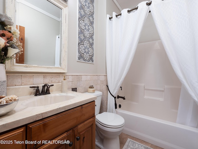 full bathroom with vanity, shower / tub combo with curtain, and toilet