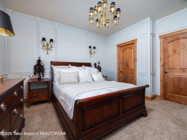 bedroom featuring ornamental molding, carpet floors, and a chandelier