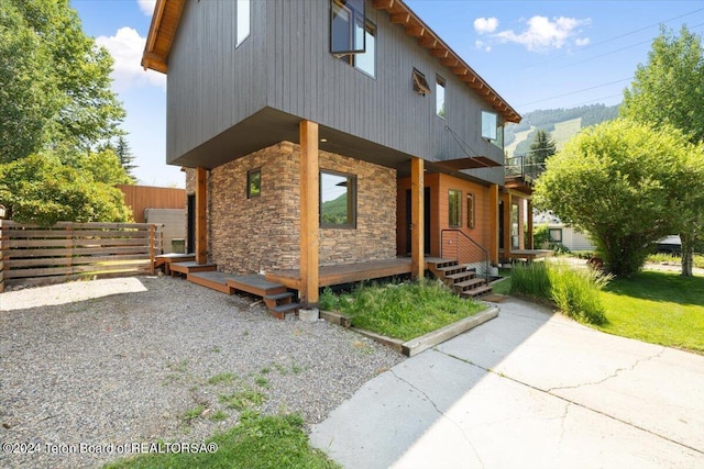 view of side of property featuring a patio