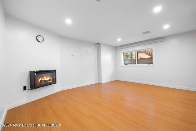 unfurnished living room with light hardwood / wood-style floors