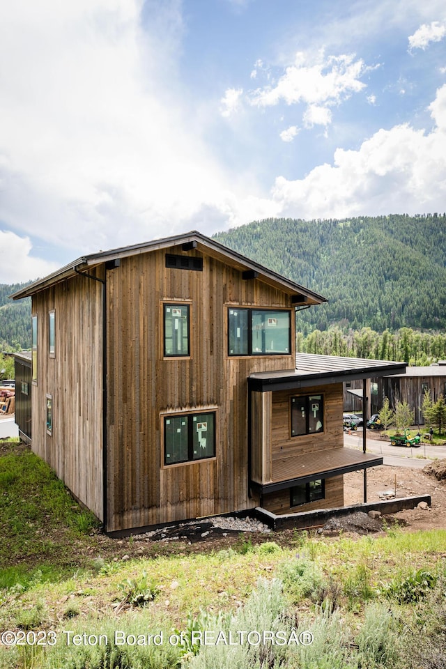 exterior space featuring a mountain view