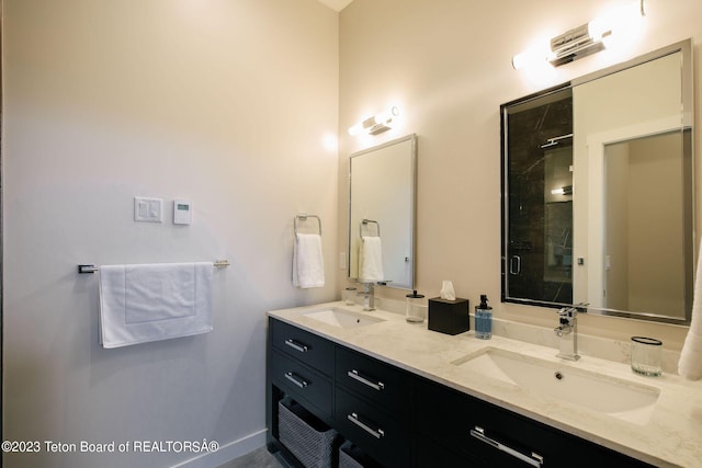 bathroom featuring walk in shower and vanity