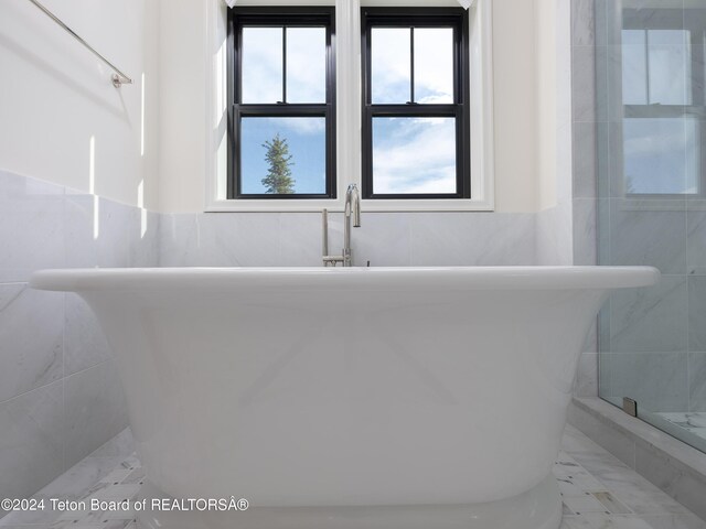 bathroom featuring plus walk in shower