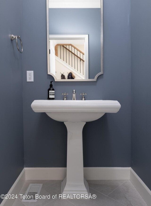 bathroom featuring tile patterned flooring