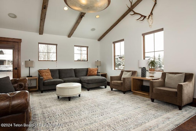 living area with recessed lighting, lofted ceiling with beams, and wood finished floors